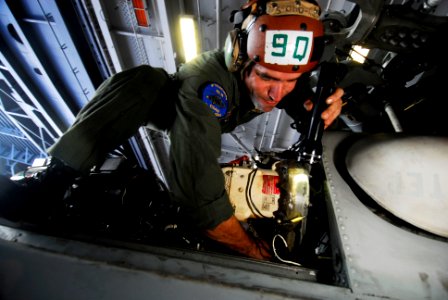 US Navy 080725-N-3946H-063 Aviation Warfare Systems Operator 1st Class Ryan Branco inspects the hydraulics system of an SH-60F Seahawk