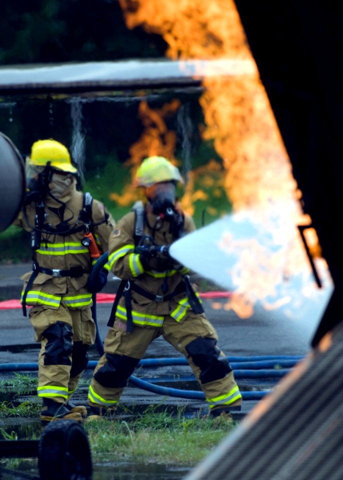 US Navy 080730-N-5253W-011 Firefighters assigned to Commander Naval Forces Japan Regional Fire Department battle a simulated aircraft fire at Naval Support Facility Kamiseya
