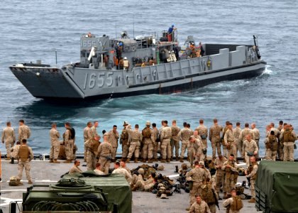 US Navy 080726-N-9134V-255 Marines assigned to the 26th Marine Expeditionary Unit wait for the docking of a landing craft utility