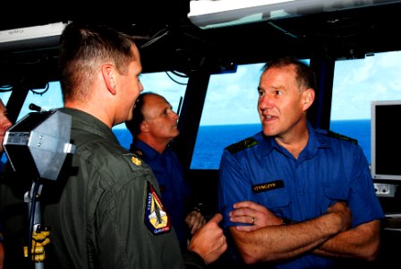 US Navy 080726-N-7883G-012 Canada's Chief of Defense Staff Gen. Walter Natynczyk discusses flight operations with Lt. Cmdr. Tom Bell aboard the aircraft carrier USS Kitty Hawk (CV 63)