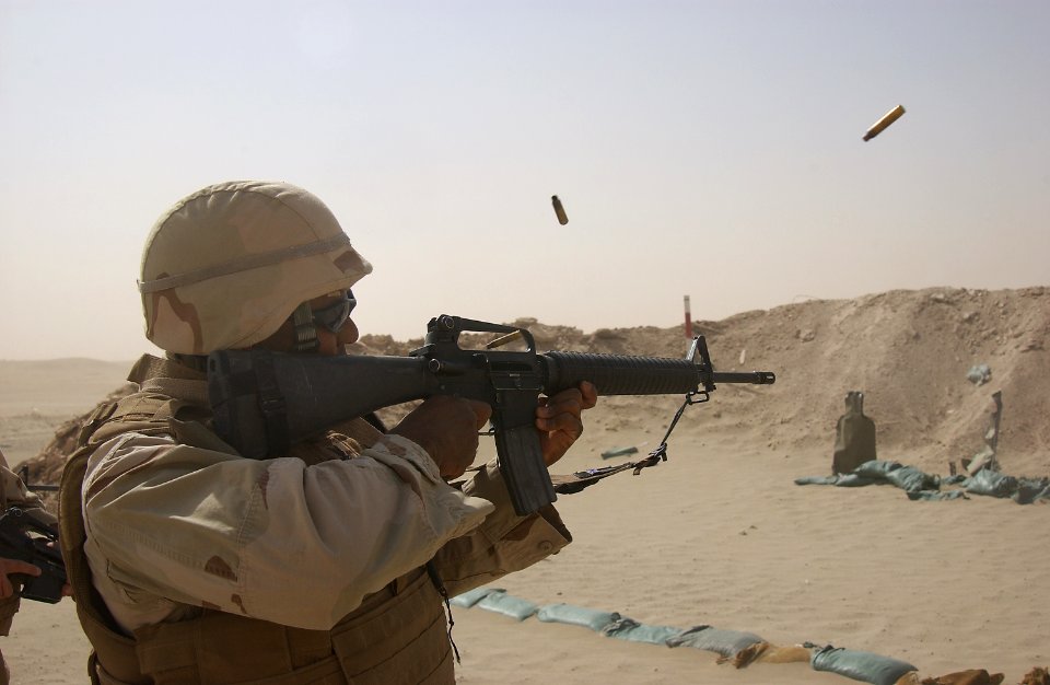 US Navy 080727-N-4198C-049 Builder 2nd Class Jason Maxwell, assigned to Naval Mobile Construction Battalion (NMCB) 3, fires an M-16
