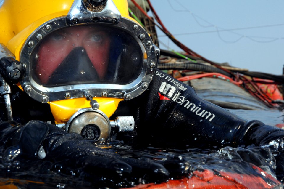 US Navy 080726-N-8298P-117 Navy Diver 1st Class Jason Potts swims on to the stern of the former Soviet submarine Juliett 484 to conduct salvage operations