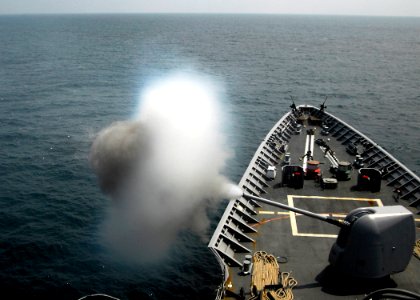 US Navy 080727-N-4236E-155 A 5-inch MK-45 Mod 2 light weight gun fires during a live fire exercise aboard the guided-missile cruiser USS Vella Gulf (CG 72) photo