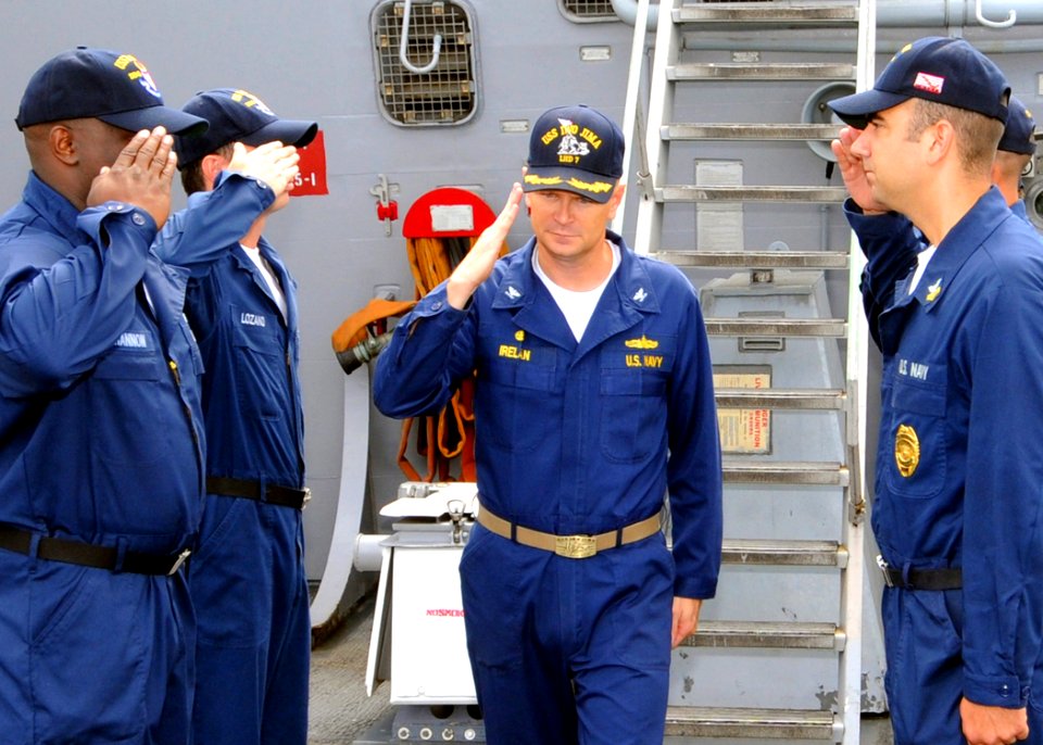 US Navy 080724-N-1082Z-008 Capt. Robert Irelan, commanding officer of the multi-purpose amphibious assault ship USS Iwo Jima (LHD 7), salutes while passing through side boys