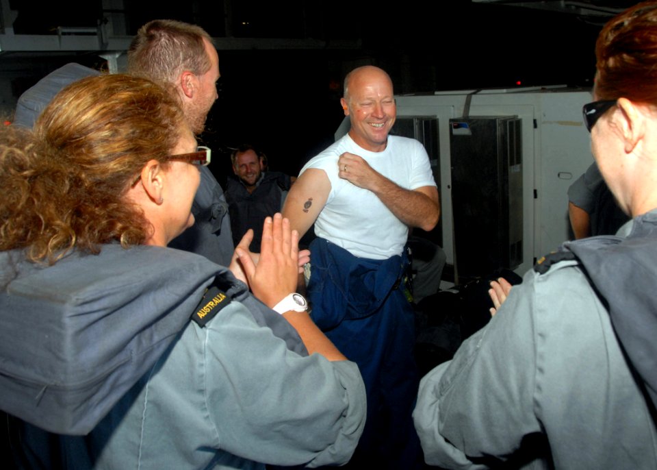 US Navy 080726-N-0515W-098 Capt. Neil Parrott shows off a temporary tattoo