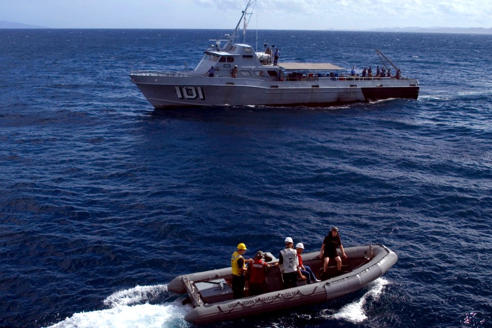 US Navy 080729-N-9123L-004 A rigid hull inflatable boat from the guided-missile destroyer USS John S. McCain (DDG 56) approaches the Fijian coastal patrol boat Levouka during an emergency medical evacuation