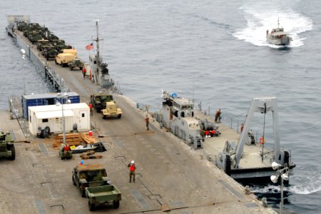 US Navy 080726-N-1424C-136 An improved Navy lighterage system is being load with M998 Humvees for the Navy roll-on-roll-off discharge facility (RRDF) for ship-to-shore operations