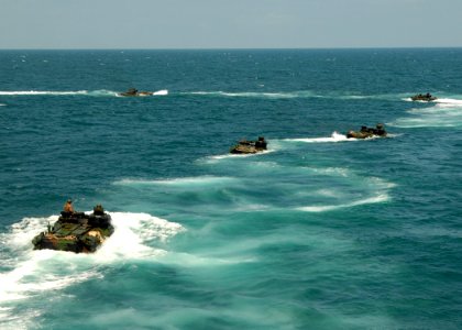 US Navy 080727-N-3392P-245 Amphibious assault vehicles assigned to the 26th Marine Expeditionary Unit (26 MEU) disembark the amphibious dock landing ship USS Carter Hall (LSD 50)