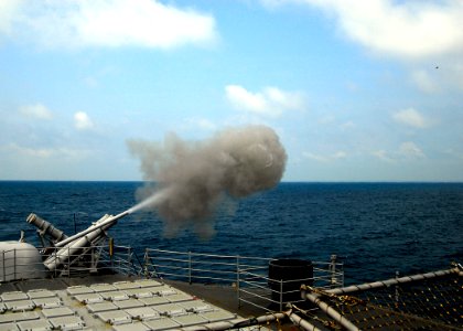 US Navy 080727-N-4236E-232 A 5-inch MK-45 Mod 2 light weight gun fires during a live fire exercise aboard the guided-missile cruiser USS Vella Gulf (CG 72)