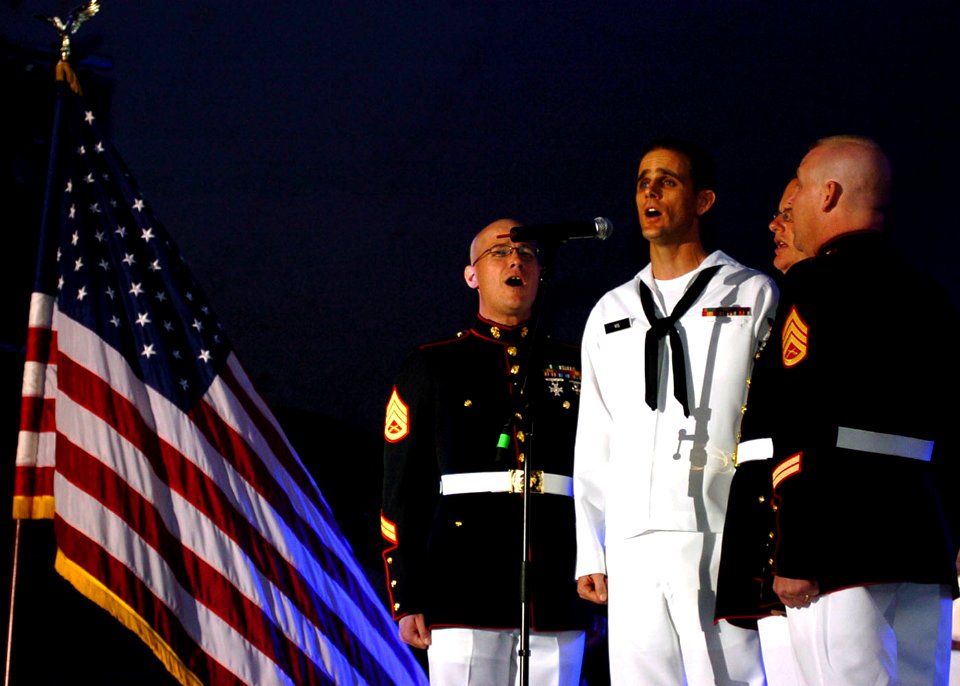 US Navy 080808-N-0841E-315 Sailors and Marines perform the national anthem to a capacity crowd of more than 15,000 fans at Little Creek Amphibious Base before a performance by country music singer Gretchen Wilson