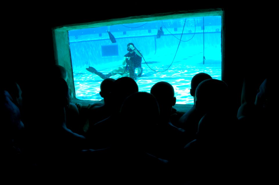 US Navy 080805-N-6552M-015 Basic Crewman Training (BCT) students watch an instructor demonstrate knot tying skills during water proficiency training at Naval Amphibious Base Coronado