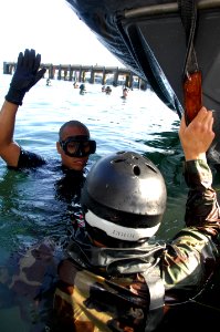 US Navy 080806-N-5366K-212 Chief Special Boat Operator Jeremy Gomez, left, a Basic Crewman Training (BCT) instructor, demonstrates a combat ascent to a student at Naval Amphibious Base Coronado
