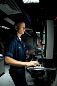 US Navy 080805-N-4995K-095 Sonar Technician (Surface) 1st Class Thomas Adams monitors the sonar display photo