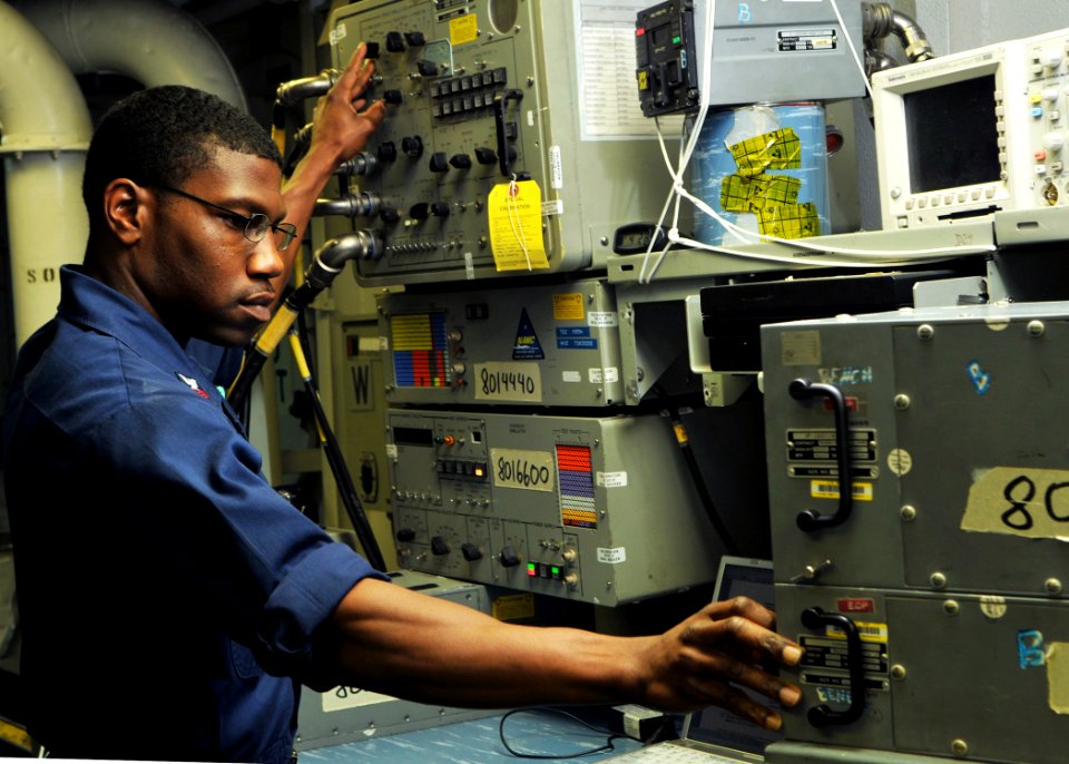 US Navy 080731-N-7981E-160 Aviation Electronics Technician 1st Class Maurice Fields, from Rochester, N.Y., conducts a performance standard test on an AQS-13F Sonar System aboard the Nimitz-class aircraft carrier USS Abraham Lin