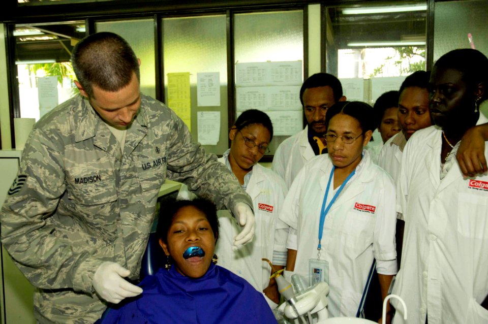 US Navy 080807-N-0209M-001 Air Force Tech. Sgt. Brian Madison holds dental training with students at the University of Papua New Guinea School of Health and Medical Science