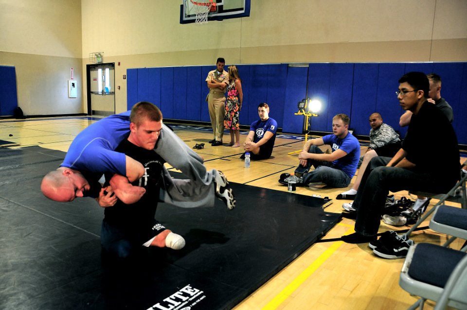 US Navy 080808-N-0640K-086 Dustin Carter, a quadruple amputee wrestler, carries his coach, Scott Goodpaster, on his shoulders to demonstrate some of his unique training techniques during a wrestling clinic for wounded warriors