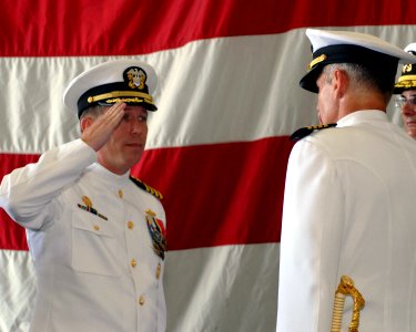 US Navy 080805-N-0483B-035 Capt. Donald A. Schmieley salutes Capt. Anthony J. Pachuta after assuming command of Amphibious Squadron (PHIBRON) 11