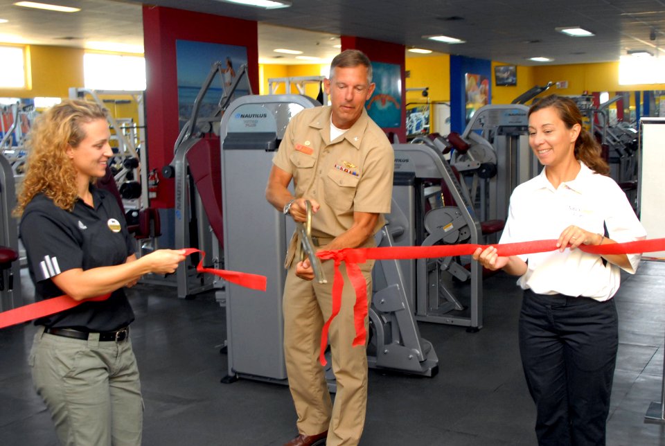 US Navy 080804-N-3289C-002 Capt. William Mosk, Stephanie Whipple, and Laurie Allard cut a ribbon officially re-opening the upgraded weight room at NAVSTA Rota