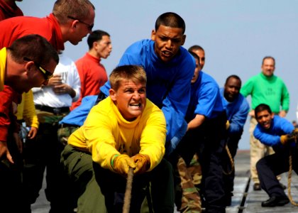 US Navy 080807-N-7571S-001 Personnel assigned to Air Department's V-1 Division participate in a shuttle pull during flight deck Olympics