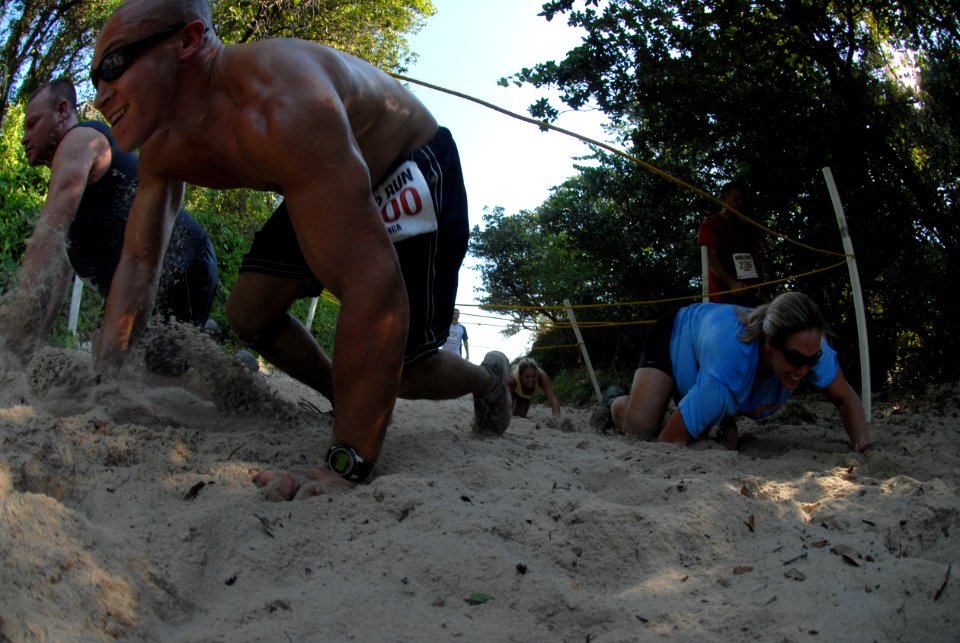 US Navy 080809-N-1688B-690 Participants of the eighth annual Health Net Armed Services YMCA (ASYMCA) Mud Run were required to run, wade and crawl through different obstacles throughout the course