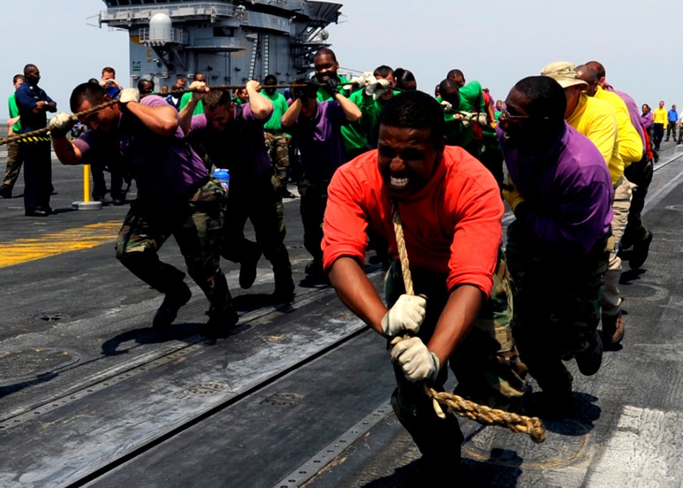 US Navy 080807-N-7241L-023 Aviation Boatswain's Mate (Handling) Airman Richard Mohamed leads a team of his shipmates during the
