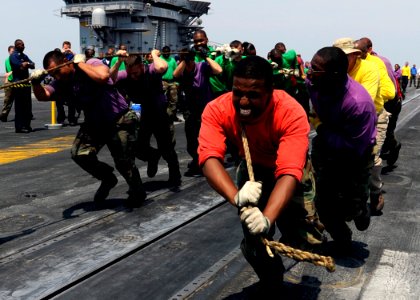 US Navy 080807-N-7241L-023 Aviation Boatswain's Mate (Handling) Airman Richard Mohamed leads a team of his shipmates during the