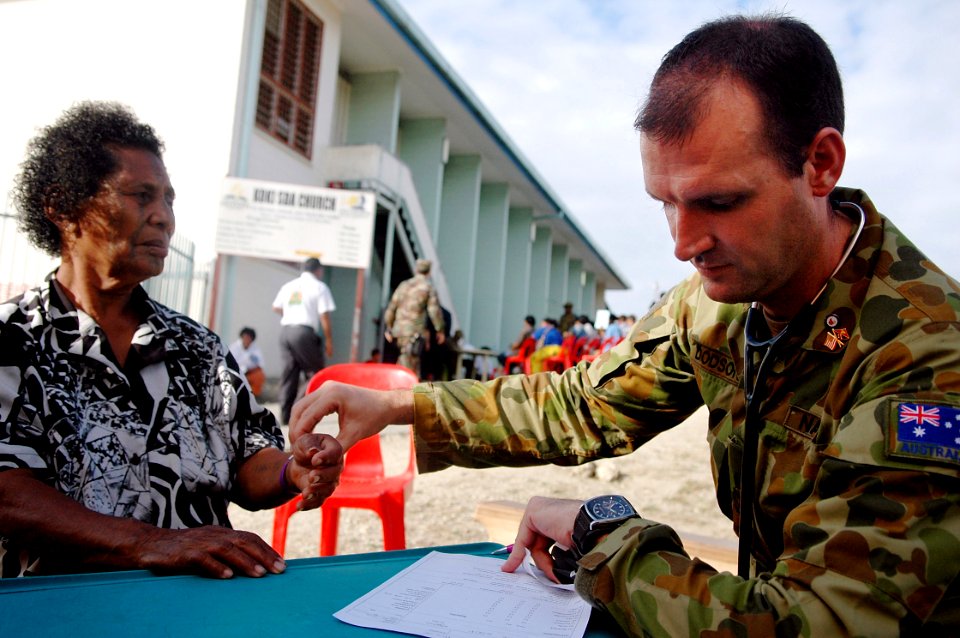 US Navy 080811-N-1328S-001 Australian Royal Navy Chief Petty Officer Dave Dodson checks the vital signs of a patient during a Pacific Partnership 2008 medical civic action program at Koki Seventh Day Adventist Church