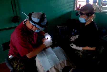 US Navy 080813-N-3595W-136 U.S. Navy and Air Force dental volunteers, embarked aboard the amphibious assault ship USS Kearsarge (LHD 3), give a dental exam to a Nicaraguan citizen