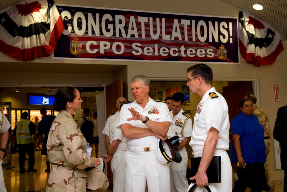 US Navy 080811-N-8273J-187 Chief of Naval Operations (CNO) Adm. Gary Roughead, center, speaks with Lt. Cmdr. Amanda Brookes and Capt. John Oberest while touring facilities at Naval Forces Central Command