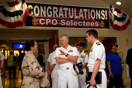 US Navy 080811-N-8273J-187 Chief of Naval Operations (CNO) Adm. Gary Roughead, center, speaks with Lt. Cmdr. Amanda Brookes and Capt. John Oberest while touring facilities at Naval Forces Central Command
