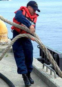 US Navy 080812-N-0483B-007 Interior Communications Electrician 3rd Class Steven Xiong, a native of St. Paul, Minn., performs line handling duties as the Arleigh-burke class guided-missile destroyer USS McCampbell (DDG 85)