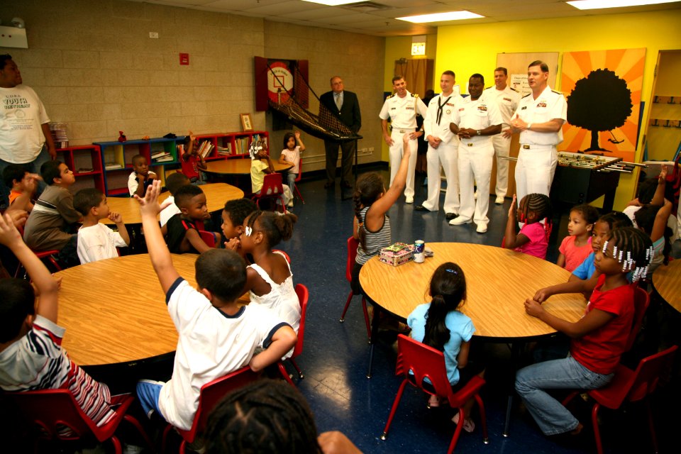 US Navy 080812-N-3271W-024 Vice Adm. David J. Venlet, commander, Naval Air Systems Command, right, and Sailors assigned to the fast-attack submarine USS Chicago (SSN 721) talk to children about life as a Sailor at the Boys and
