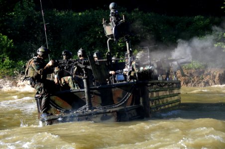 US Navy 080811-N-4205W-022 Special Warfare Combatant-craft Crewmen assigned to Special Boat Team 22 (SBT-22) conduct live-fire immediate action drills photo