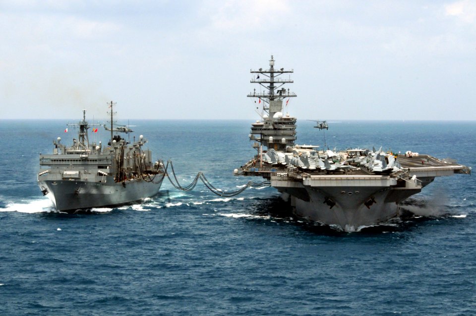 US Navy 080815-N-5961C-001 An SH-60 Sea Hawk helicopter moves pallets of supplies between the aircraft carrier USS Ronald Reagan (CVN 76) and the Military Sealift Command fast combat support ship USNS Bridge (T-AOE 10)