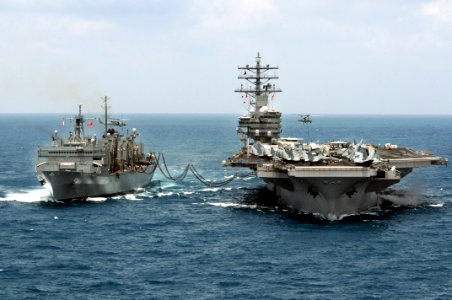 US Navy 080815-N-5961C-001 An SH-60 Sea Hawk helicopter moves pallets of supplies between the aircraft carrier USS Ronald Reagan (CVN 76) and the Military Sealift Command fast combat support ship USNS Bridge (T-AOE 10)