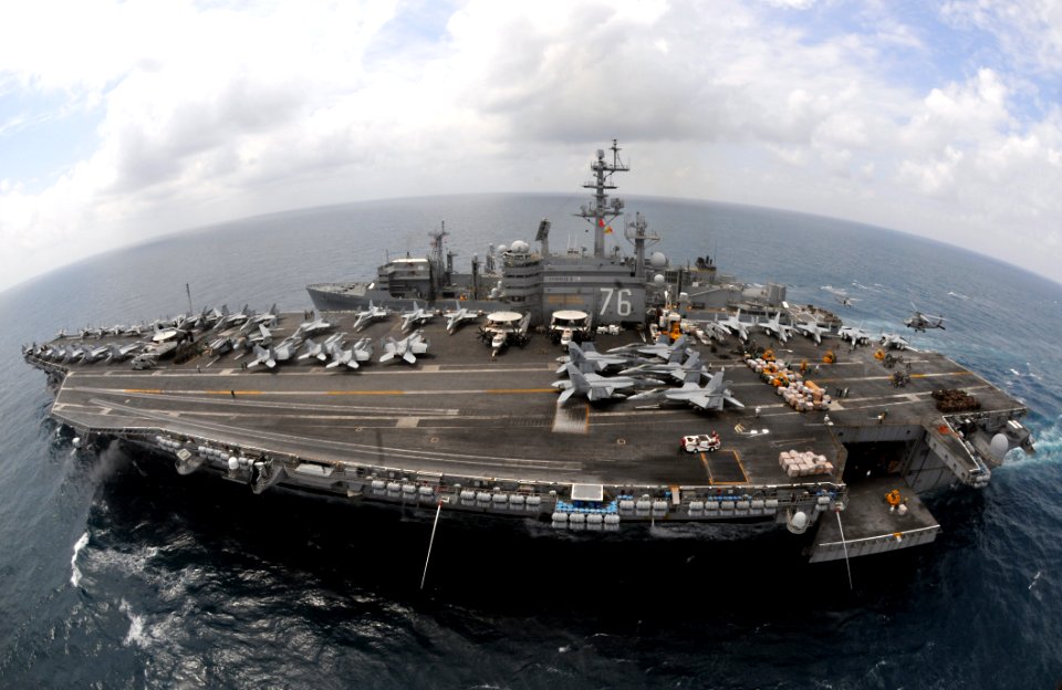 US Navy 080815-N-5961C-006 Two SH-60 Sea Hawk helicopters deliver pallets of supplies to the aircraft carrier USS Ronald Reagan (CVN 76) from the Military Sealift Command fast combat support ship USNS Bridge (T-AOE 10)
