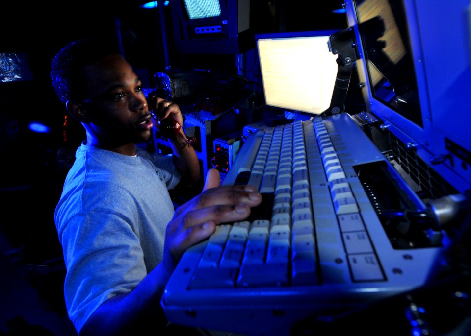 US Navy 080813-N-7981E-128 Operations Specialist 2nd Class Kindred Heard, from Loachapoka, Ala., communicates with the guided-missile destroyer USS Shoup (DDG 86)