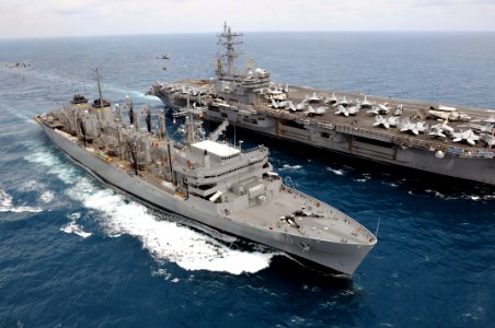 US Navy 080815-N-5961C-004 Two SH-60 Sea Hawk helicopters move pallets of supplies between the aircraft carrier USS Ronald Reagan (CVN 76) and the Military Sealift Command fast combat support ship USNS Bridge (T-AOE 10)