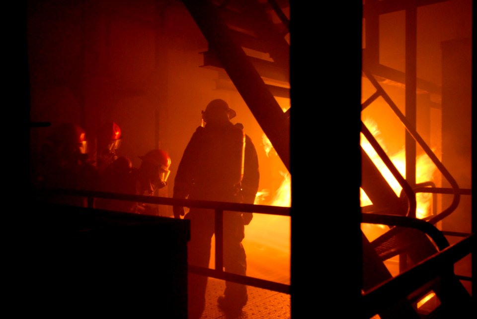 US Navy 080813-N-6936D-080 Members of the No. 1 hose team from Repair Locker 2M of the amphibious assault ship USS Essex (LHD 2) fight a fire at the Center for Naval Engineering Learning Site, Yokosuka