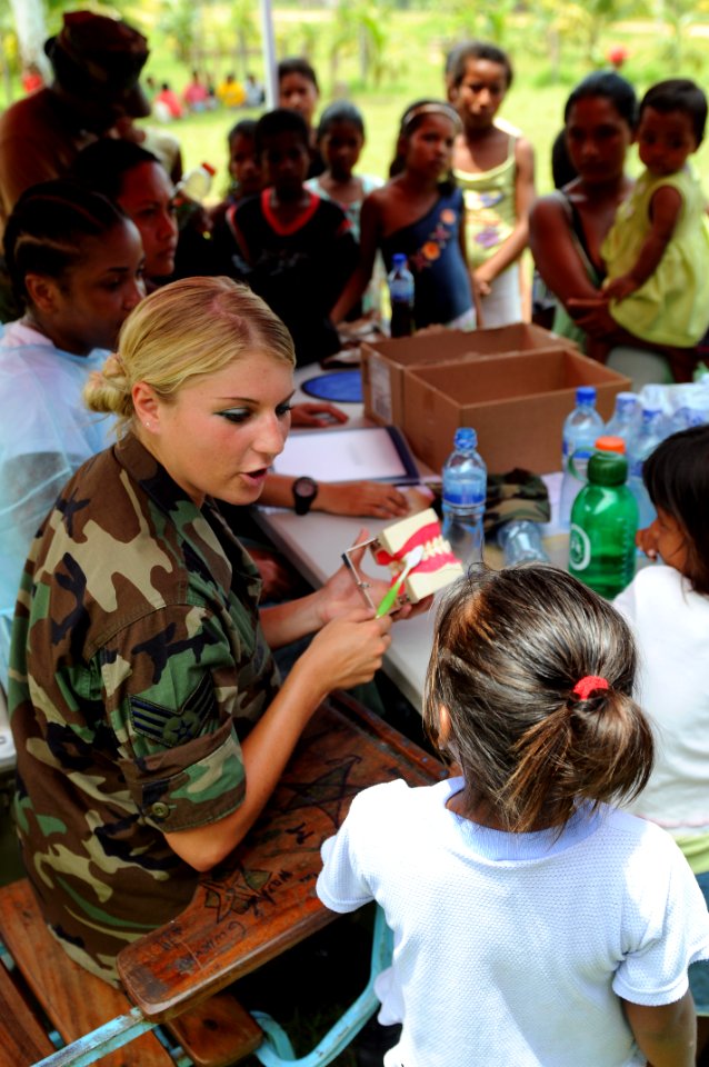 US Navy 080817-N-7955L-141 Senior Airman Alexandra Olson, embarked aboard the amphibious assault ship USS Kearsarge (LHD 3), teaches children how to properly brush their teeth at the Betania medical clinic