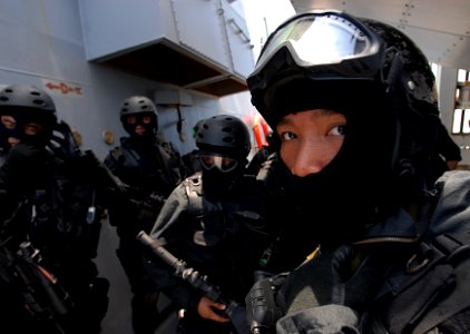 US Navy 080818-N-1635S-008 Members of the Brunei Special Forces await the start of a visit, board, search and seizure (VBSS) exercise aboard the Arleigh Burke-class guided-missile destroyer USS Howard (DDG 83)