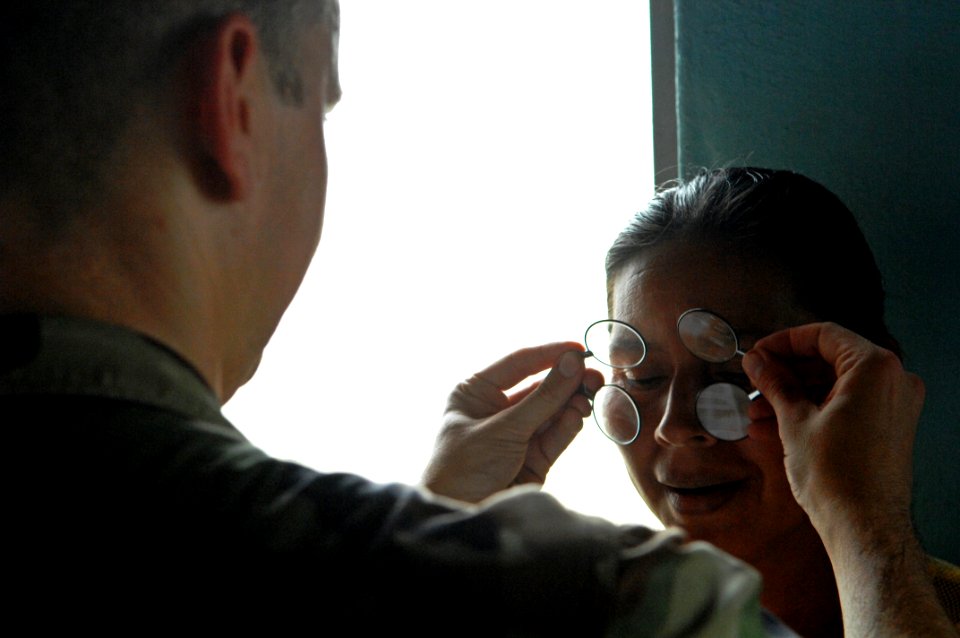 US Navy 080813-N-7544A-086 Lt. Jonny L. Cosby checks the vision of a Nicaraguan woman to prescribe glasses during a humanitarian assistance project in Puerto Cabezasn Nicaragua during the Caribbean phase of Continuing Promise 2