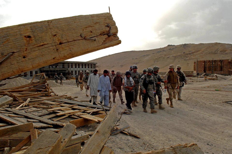 US Navy 080815-N-8273J-518 Chief of Naval Operations (CNO) Adm. Gary Roughead, tours a schoolhouse construction site with members of Provincial Reconstruction Team (PRT) Ghazni