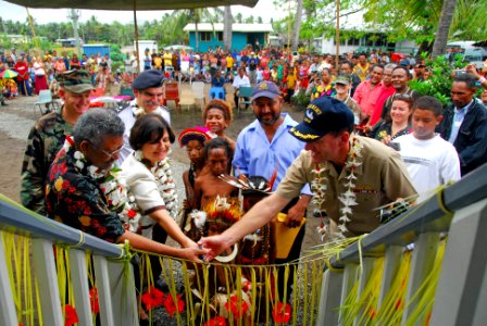 US Navy 080816-N-9689V-012 Henao Iduhu, the Gaire Community Representative, The Honorable Leslie Rowe, Ambassador of the United States, and Capt. William A. Kearns, Pacific Partnership mission commander, join in a ribbon cuttin