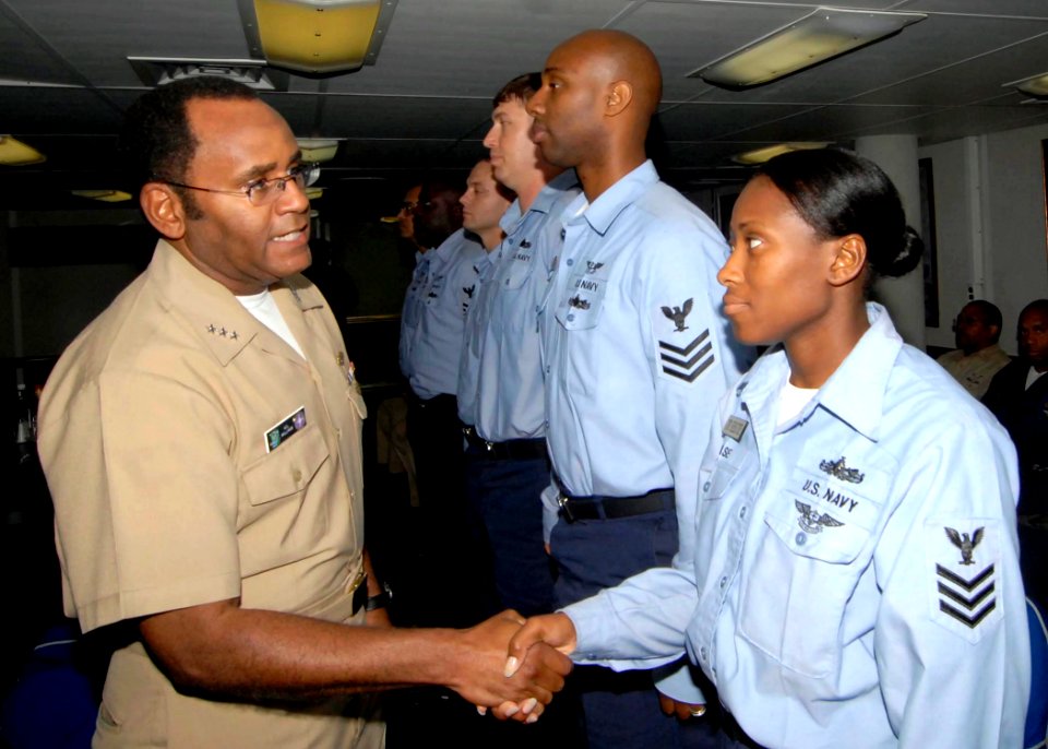 US Navy 080815-N-5712P-015 Vice Adm. Melvin G. Williams greets Chief Boatswain's Mate (Sel) Cherise T. Chase