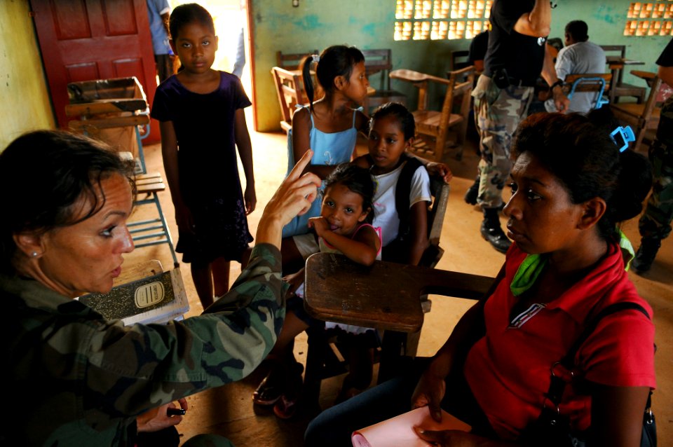 US Navy 080817-N-4515N-180 Air Force Capt. Fe Lobo-Menendez, a medical augmentee and translator embarked aboard the amphibious assault ship USS Kearsarge (LHD 3), tells a Nicaraguan woman where to find the pharmacy