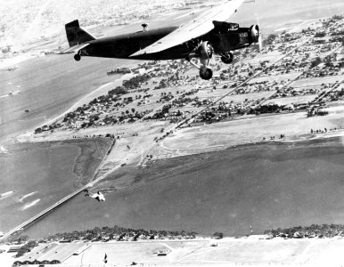 US Navy Ford RR-3 dropping parachutist over NAS North Island in the early 1930s