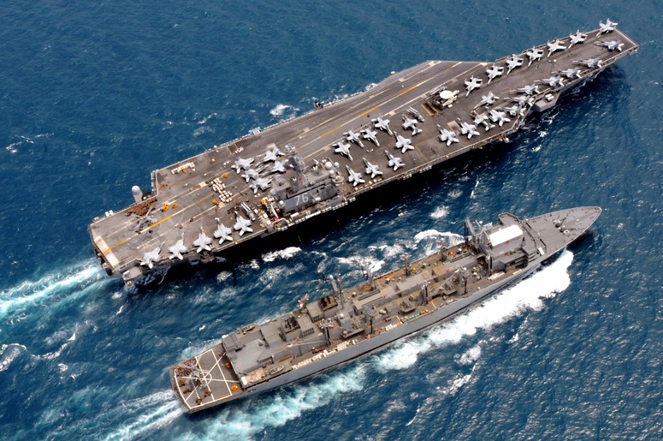 US Navy 080815-N-5961C-002 The aircraft carrier USS Ronald Reagan (CVN 76) and the Military Sealift Command fast combat support ship USNS Bridge (T-AOE 10) maneuver together during a replenishment at sea