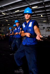 US Navy 080815-N-7730P-089 The underway replenishment crew aboard the Nimitz class aircraft carrier USS Ronald Reagan (CVN 76) tensions the six-foot messenger line to receive cargo