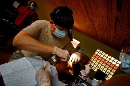 US Navy 080820-N-9620B-005 Air Force Col. Daniel Dupont extracts a tooth from a local Nicaraguan man